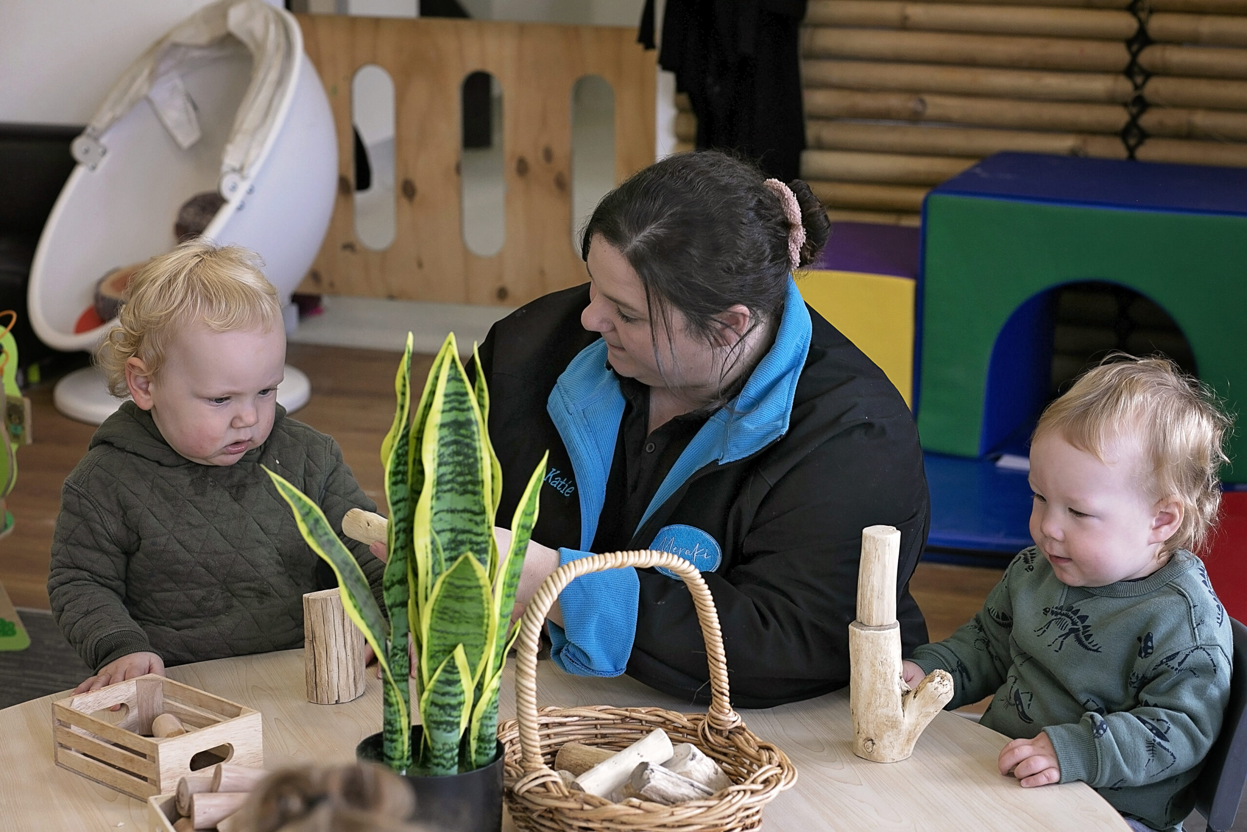 Educator with children playing with blocks
